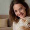 Francesca Lewis with her cat in the lounge