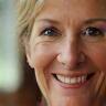 Laura Williams smiling in her home