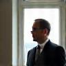 Omid Yazdani beside bay window